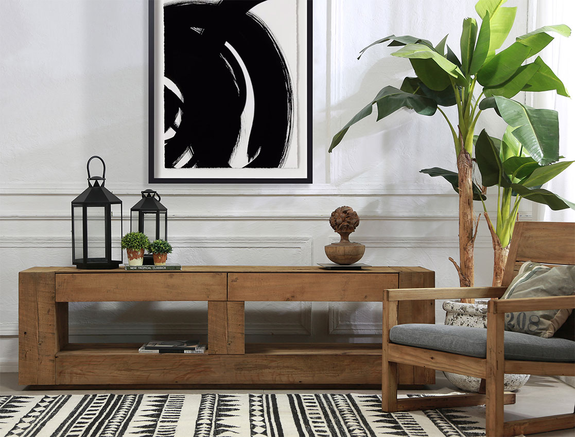 Wooden, rustic rectangular shaped TV stand against white wall in rustic styled living room